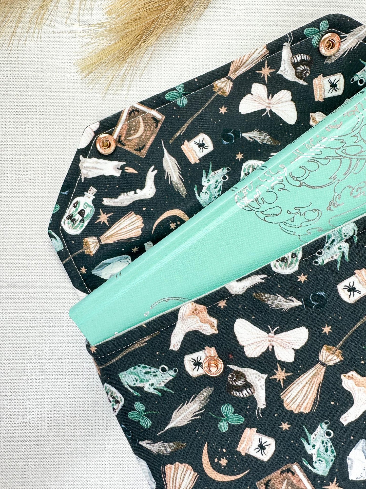 Spell Caster Fall Halloween padded protective book sleeve with secure snap closure for paperbacks hardcovers and e-readers like kindle