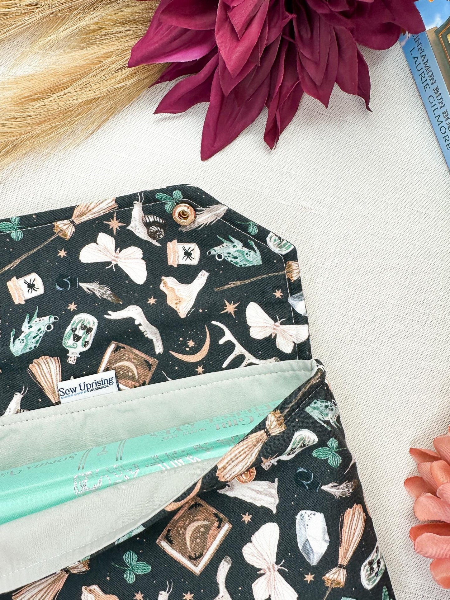 Spell Caster Fall Halloween padded protective book sleeve with secure snap closure for paperbacks hardcovers and e-readers like kindle